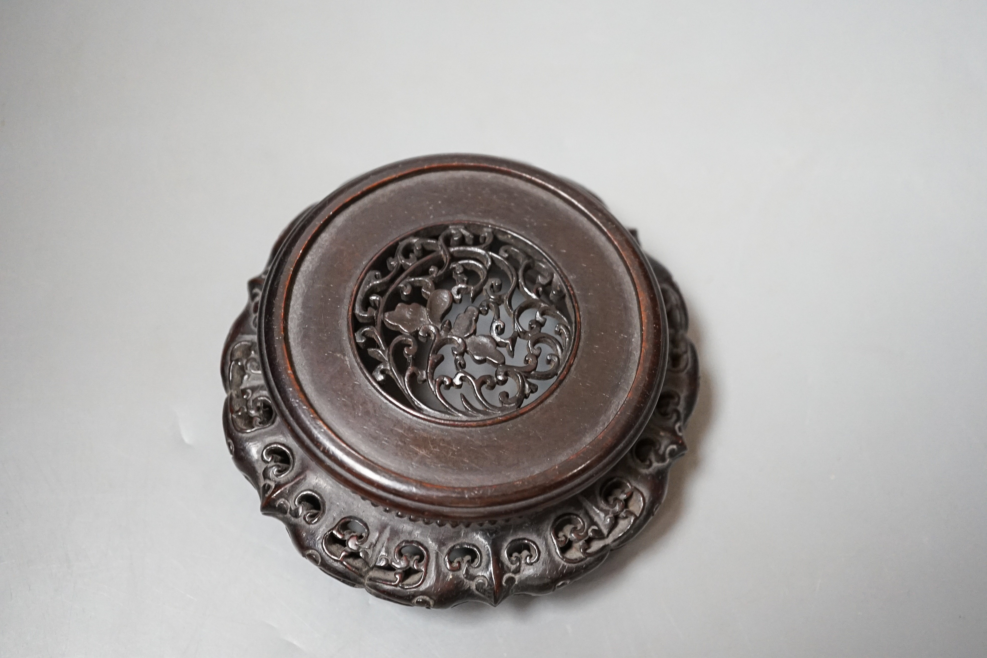 A fine 19th century Chinese hardwood stand, 11.4cm diameter